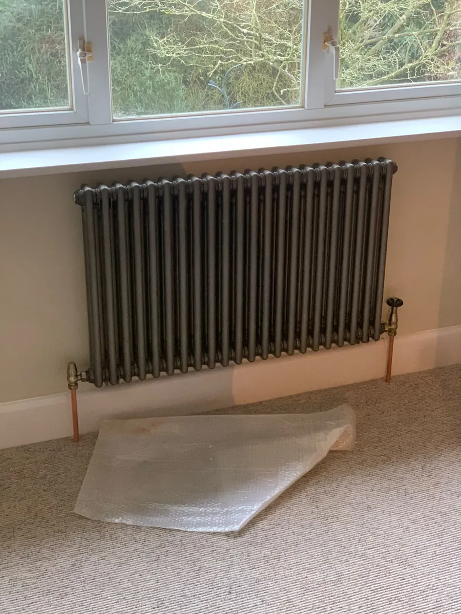 Column radiator fitted on copper pipework in Telford